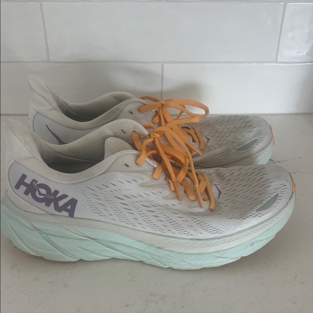 Hoka Women's Running Shoes in White with Mint Sole and Orange Laces